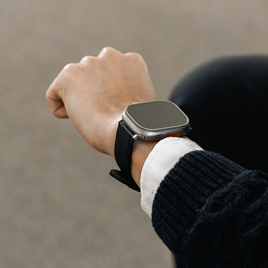 Labovarde Apple Watch Band in Black — Close-up view of a wrist wearing the strap on an Apple Watch Ultra