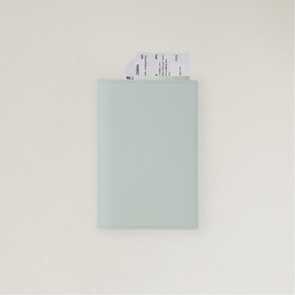 Labovarde Passport Case in Clear Blue — front view showing passport cover and Tickets in Case on a white Background