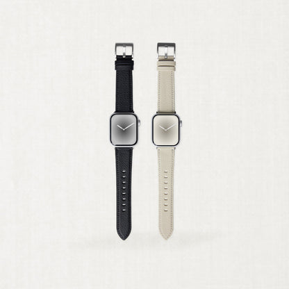 Two minimalist Labovarde Apple Watch bands made of sustainable corn-based bio-leather in black and warm beige, displayed side-by-side on a light neutral background