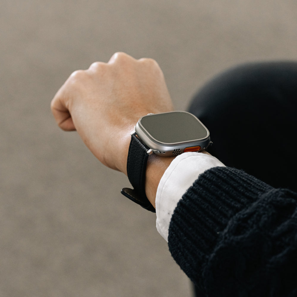 Labovarde Apple Watch Band in Black — Close-up view of a wrist wearing the strap on an Apple Watch Ultra