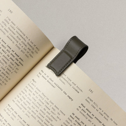 Labovarde Book Clip in Etoupe — Close-up view of the clip holding a page of a book