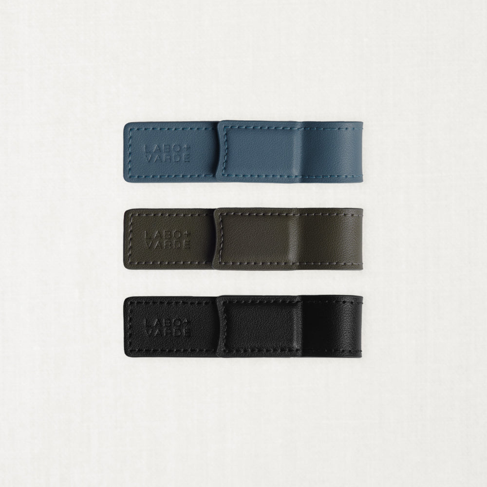 Labovarde Book Clips in Black, Etoupe, and Pale-Blue — Flat lay view showing the blind debossed logo and neat stitching