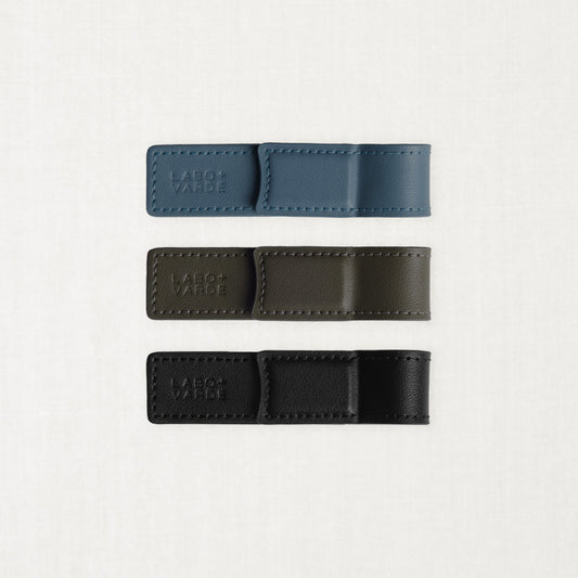 Labovarde Book Clips in Black, Etoupe, and Pale-Blue — Flat lay view showing the blind debossed logo and neat stitching