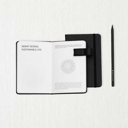 Labovarde Handy Note in Black — Flat lay view of open and closed handy notes with a pencil on a white background