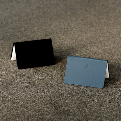 Labovarde Handy Notes in Black and Pale-Blue — Perspective view of two notes standing on a textured surface