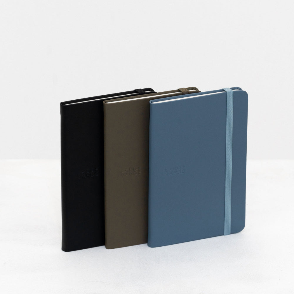 Labovarde Handy Note in Black, Etoupe, and Pale-Blue — Staggered upright view showing the elastic bands and debossed logos