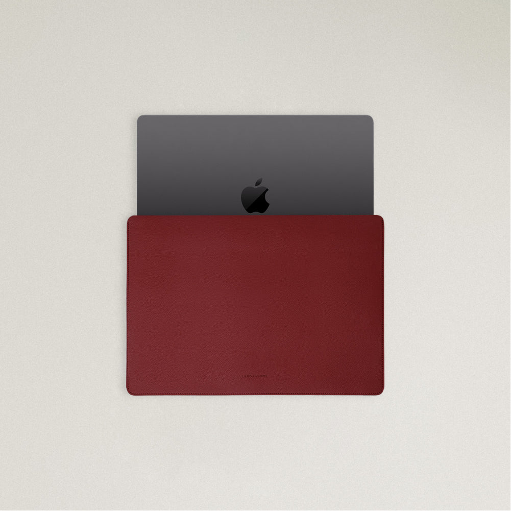 Labovarde Laptop Sleeve in Red — Top view with a space gray MacBook partially inserted to show the sleek fit