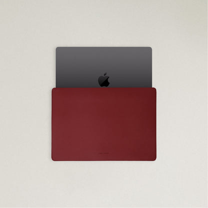 Labovarde Laptop Sleeve in Red — Top view with a space gray MacBook partially inserted to show the sleek fit