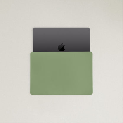 Labovarde Laptop Sleeve in Sage Green — Top view with a space gray MacBook partially inserted to show the sleek fit