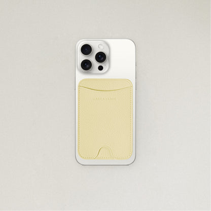 Labovarde MagSafe Card Wallet in Light Yellow — Attached to a white iPhone, showing the magenetic fit and debossed logo