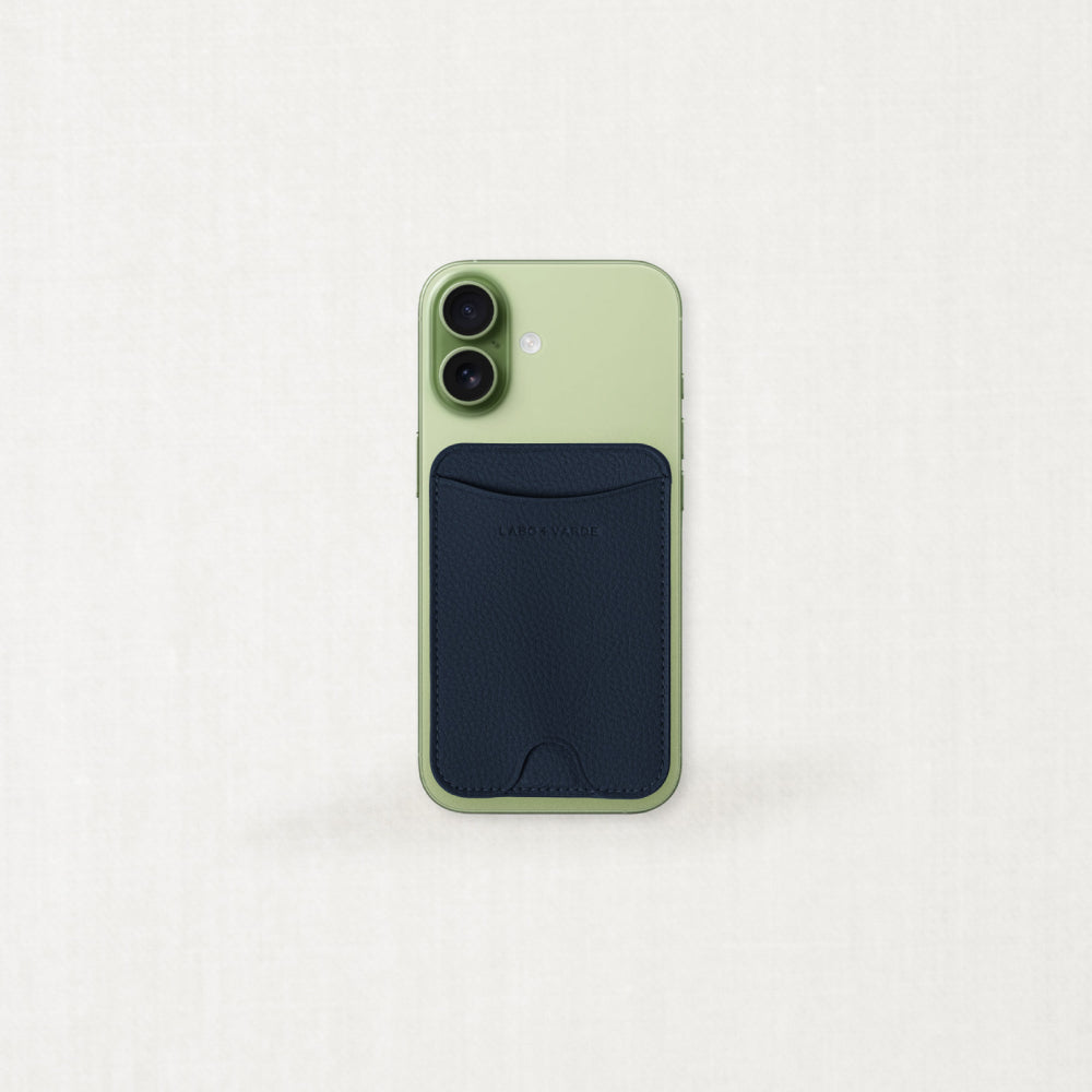 Labovarde MagSafe Card Wallet in Navy — Front view Attached to a Green iPhone