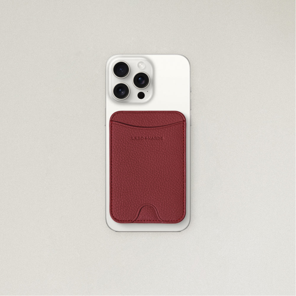 Labovarde MagSafe Card Wallet in Red — Attached to a white iPhone, showing the magenetic fit and debossed logo