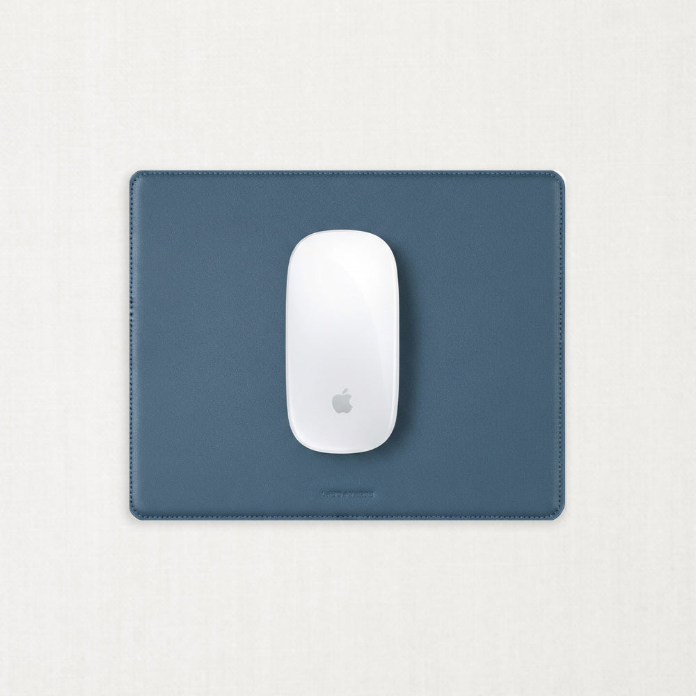Labovarde Mouse Pad in Pale-Blue — Top-down view of a whit mouse on the Pale-Blue Mouse Pad
