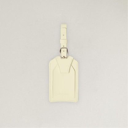 Labovarde Name Tag in Light Yellow — Front view centered on a minimalist textured white background
