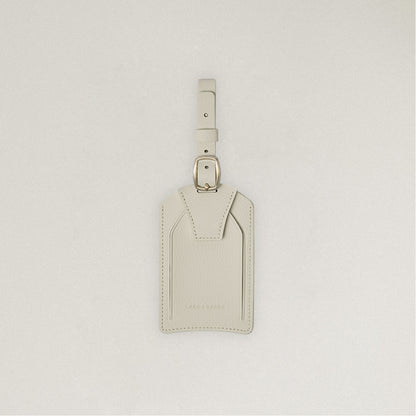 Labovarde Name Tag in Sand Gray — Front view centered on a minimalist textured white background