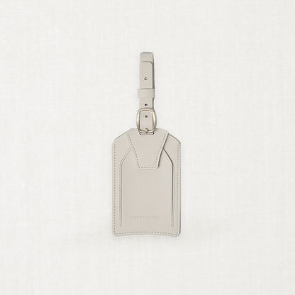 Labovarde Name Tag in Sand Gray — Front view centered on a minimalist textured white background