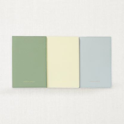 Labovarde Passport Case — front view of 3 Colors showing Sage Green, Light Yellow and Clear Blue options on a white Background