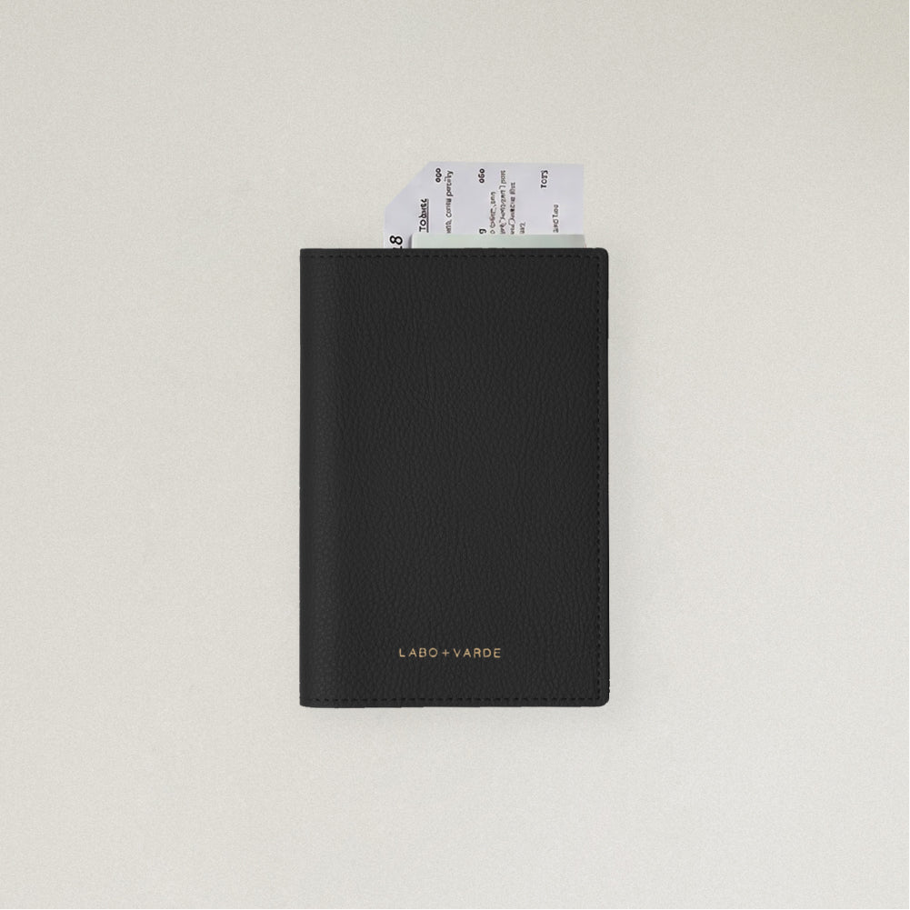 Labovarde Passport Case in Black — front view showing passport cover and Tickets in Case on a white Background