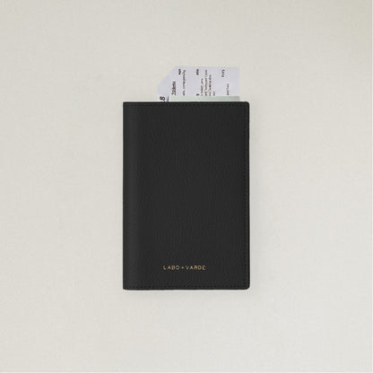 Labovarde Passport Case in Black — front view showing passport cover and Tickets in Case on a white Background