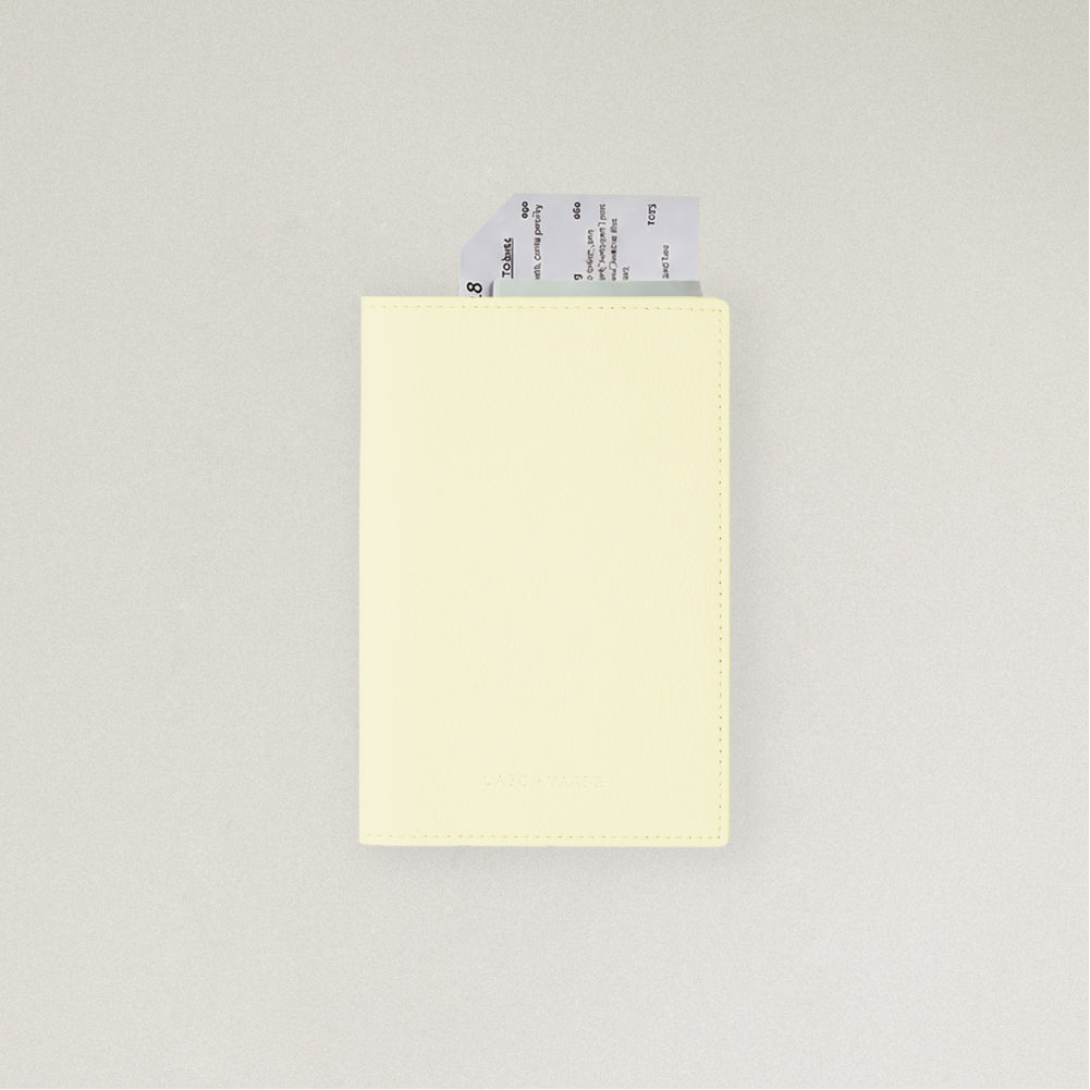 Labovarde Passport Case in Light Yellow — front view showing passport cover and Tickets in Case on a white Background