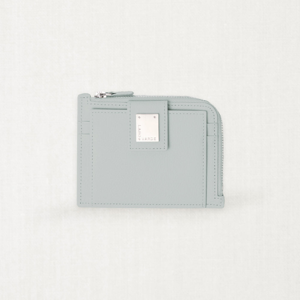 Labovarde Zipper Card Wallet in clear-blue — Front view highlighting the signature silver metal plate and zipper closure
