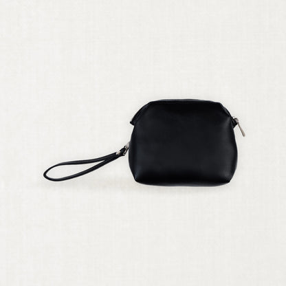 Labovarde Shell Pouch Bag in Black — Clean front view highlighting the top zipper closure and convenient wristlet strap.