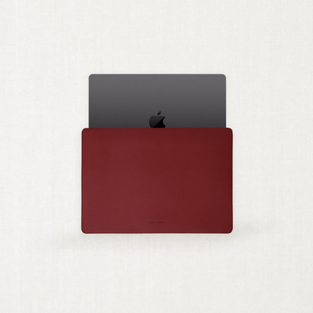 Two minimalist Labovarde Apple Watch bands made of sustainable corn-based bio-leather in black and warm beige, displayed side-by-side on a light neutral background