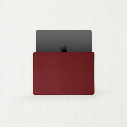 Two minimalist Labovarde Apple Watch bands made of sustainable corn-based bio-leather in black and warm beige, displayed side-by-side on a light neutral background